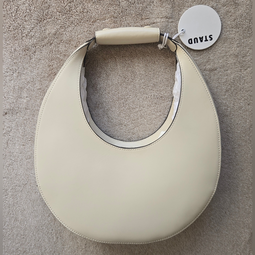 STAUD Polished Crescent Moon Shoulder Bag in Cream